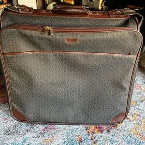 Hartmann wings 50” garment bag plus 22” carry on.